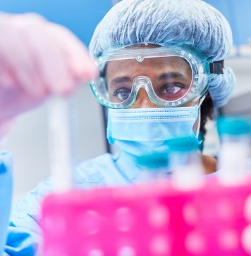 healthcare worker analysing vaccines for covid-19