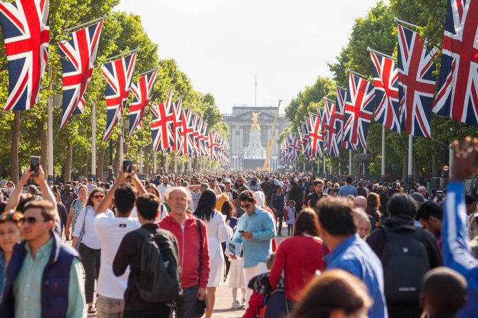 LONDON, ENGLAND- 2 June 2022: People gathered on the mall for the Queen`s Platinum Jubilee event in London