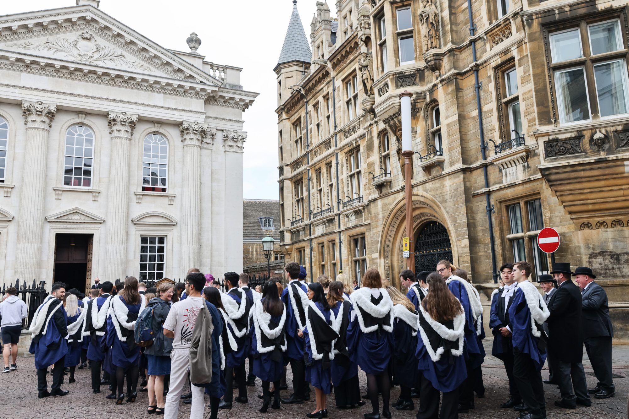 students and Officials in front of Senate House during graduation procession and ceremony, University of Cambridge, UK