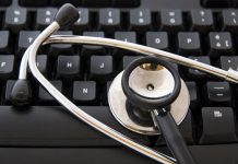 Stethoscope by a computer keyboard