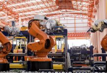 Robots welding in a production line