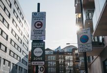 Signs indicating Ultra Low Emission Zone ULEZ on a street in London, UK