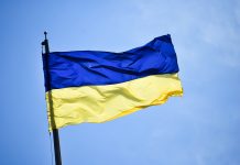 National flag of Ukraine with background of clear blue sky