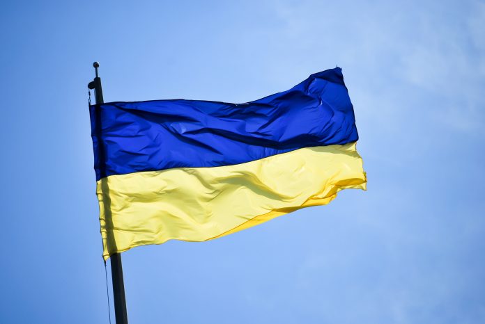 National flag of Ukraine with background of clear blue sky