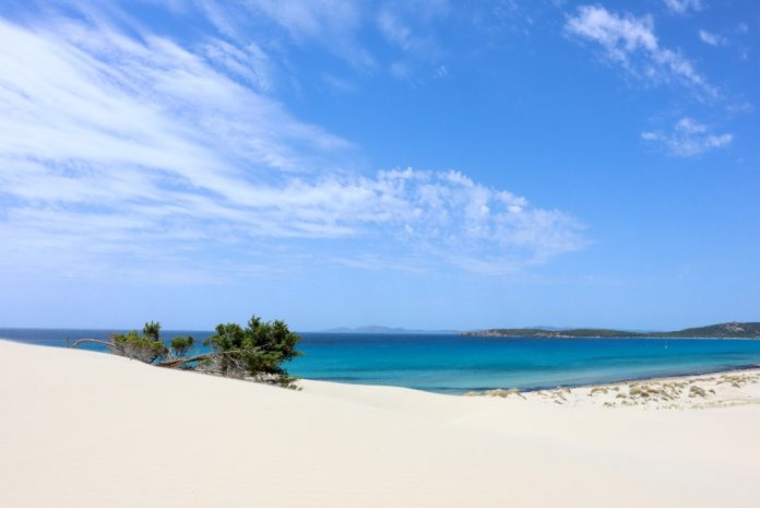 Iconic sandy beach and coastal dune system in Porto Pino (Italy)