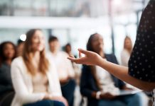 Cropped shot of a businesswoman delivering a speech during a conference