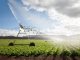 An irrigation machine spraying water on a large field.