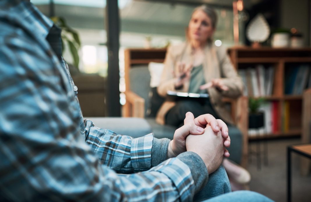 Cropped shot of a man having a therapeutic session with a psychologist