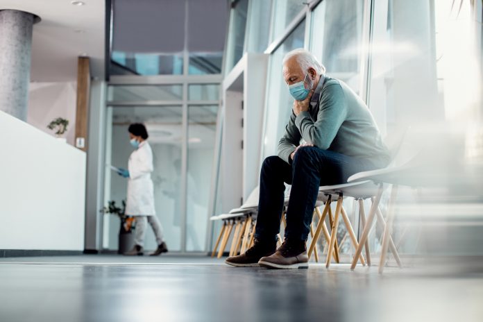 man in a patient waiting room