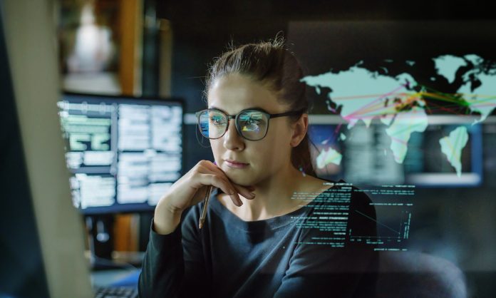 woman on computer looking at data