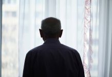 Man standing at window