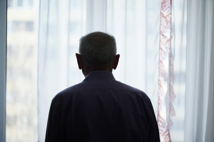 Man standing at window