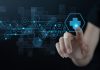 Medical technology, Telemedicine, virtual hospital, online medical concept. Woman hand touching health button on virtual screen with medical icons set on dark background - Antisense therapies: A new approach to tackling challenging targets in areas of high unmet medical need