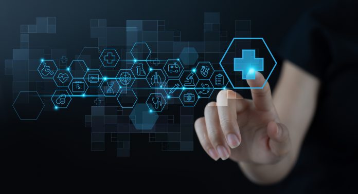 Medical technology, Telemedicine, virtual hospital, online medical concept. Woman hand touching health button on virtual screen with medical icons set on dark background - Antisense therapies: A new approach to tackling challenging targets in areas of high unmet medical need