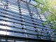 Solar Panel wall on Building with tree leaves