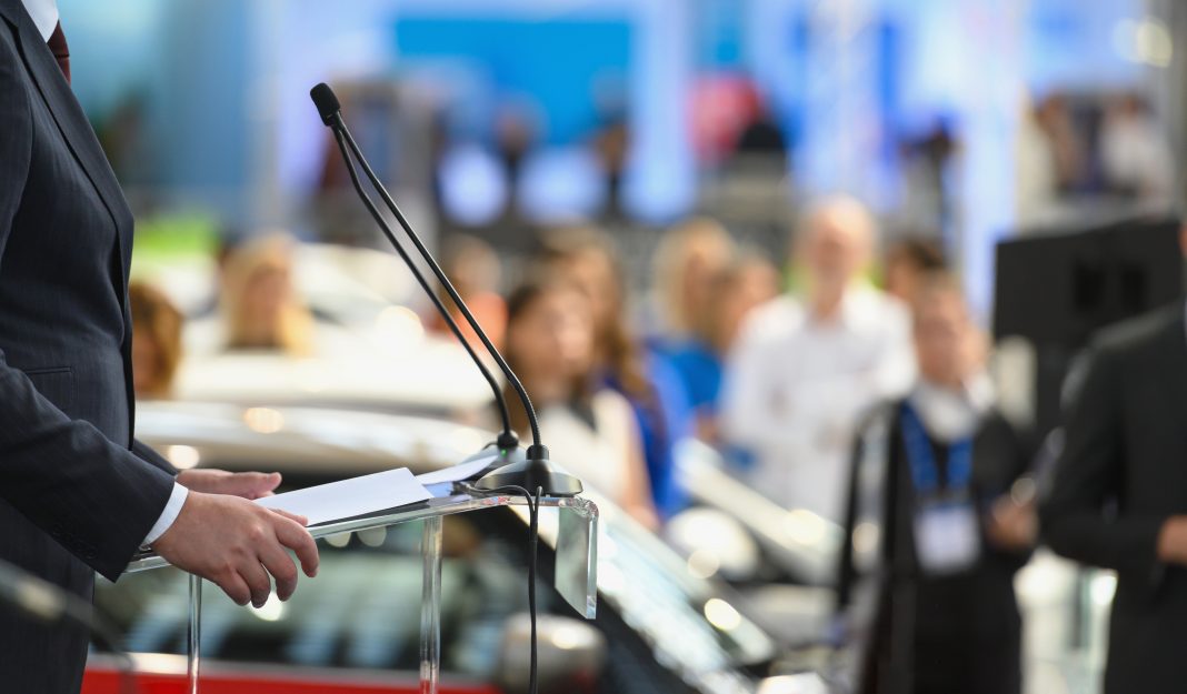 Politician speaking publicly from the lectern during political rally, Nikon Z7