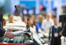 Politician speaking publicly from the lectern during political rally, Nikon Z7