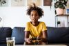 child playing on playstation at home