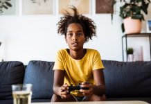 child playing on playstation at home