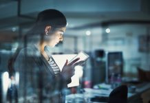 businesswoman in the office on mobile device