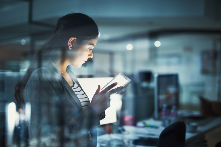 businesswoman in the office on mobile device