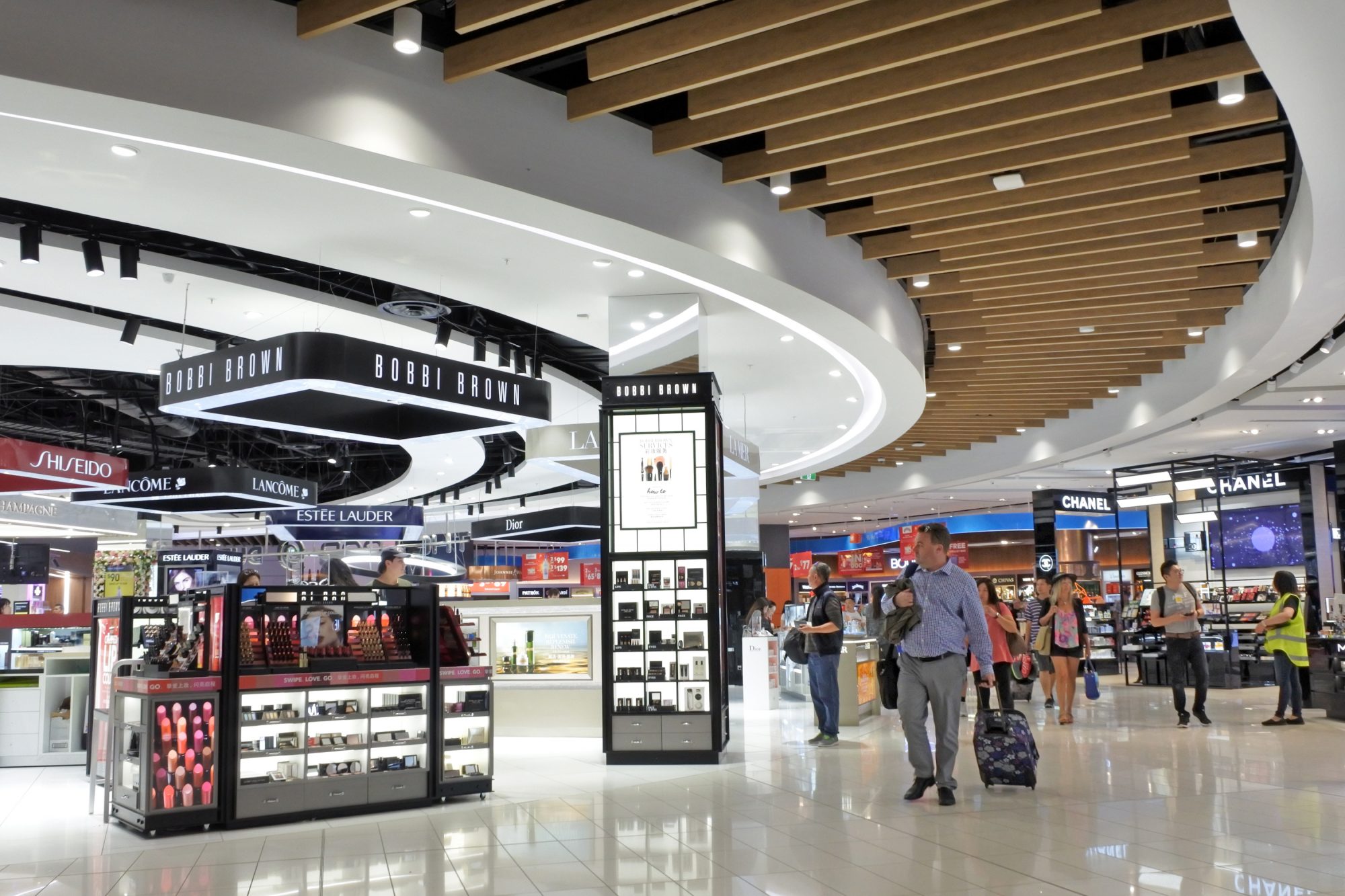 passengers in an airport shopping