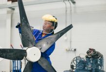 girl learning to design windmills at university