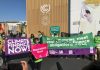 Climate activists emphasizing the urgency of climate finance at COP27