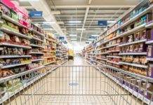 Unrecognizable supermarket aisle as background, an array of food - intimidating for those with eating disorders