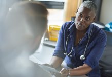 medical consultation with female doctor in NHS