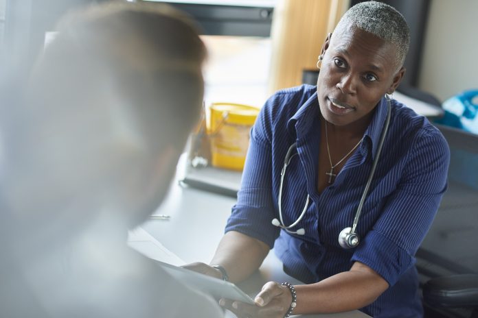 medical consultation with female doctor in NHS