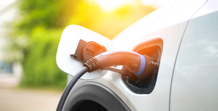 Electric Car Charging At Power Station