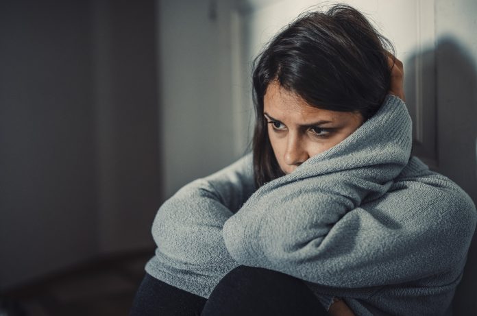 Close up of young woman struggling from mental breakdown