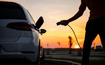 man charging his EV