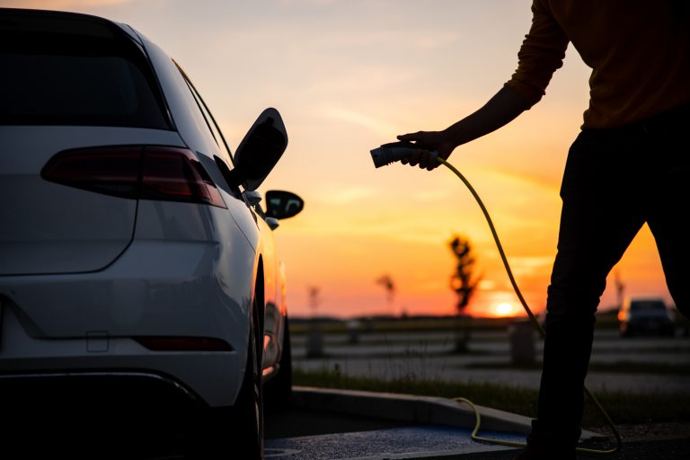 man charging his EV