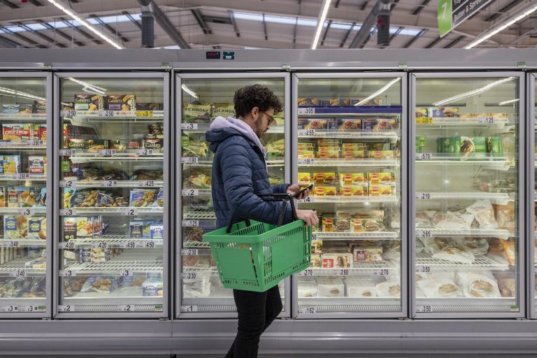 man in supermarket shopping