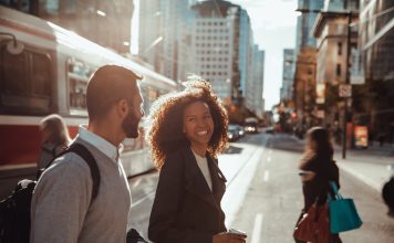 Business people on the go in city downtown on their way to the office.