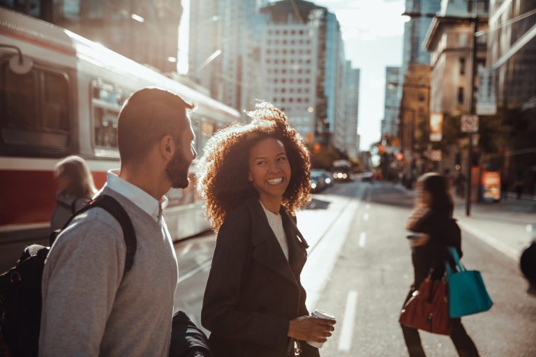 Business people on the go in city downtown on their way to the office.