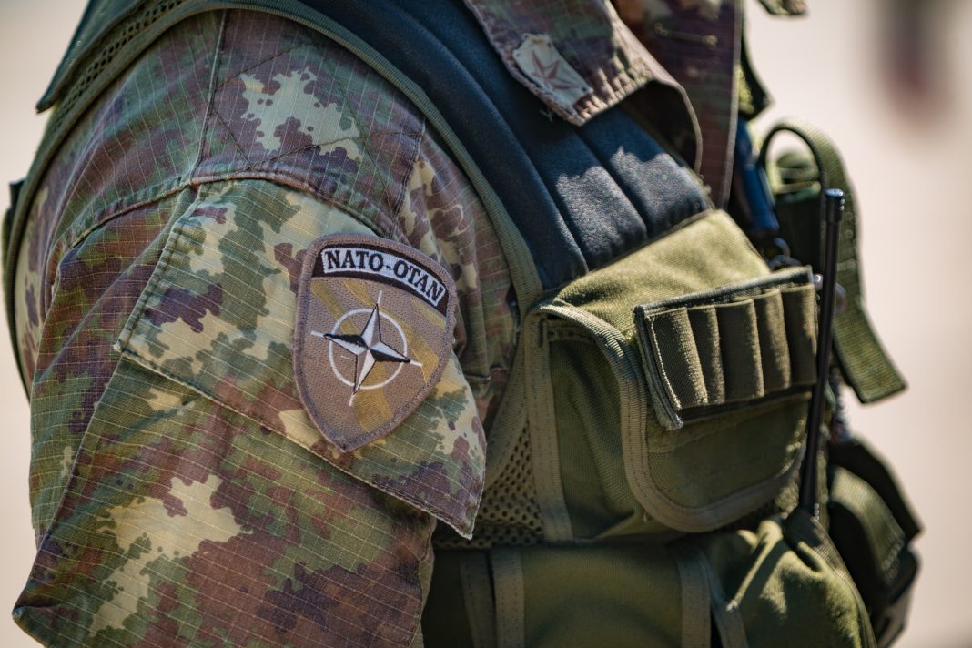 Pisignano, ITALY - Apr 18, 2013: Italian NATO soldier attending at an italian military public event. Detail of uniform.