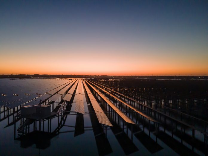 Early in the morning, the photovoltaic power station by the sea