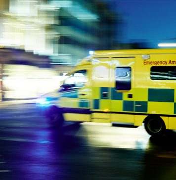 Ambulance car moving at night