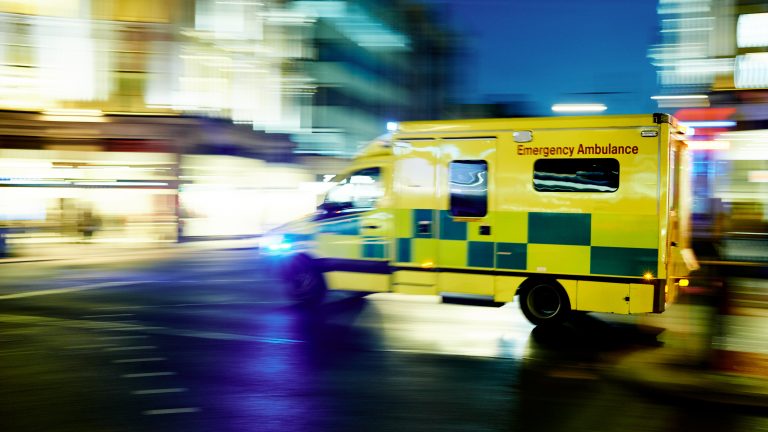 Ambulance car moving at night