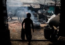 Dhaka, Bangladesh - March 26,2016: A Child Laborer is working inside a workshop at the Dock Yard in Dhaka, Bangladesh.