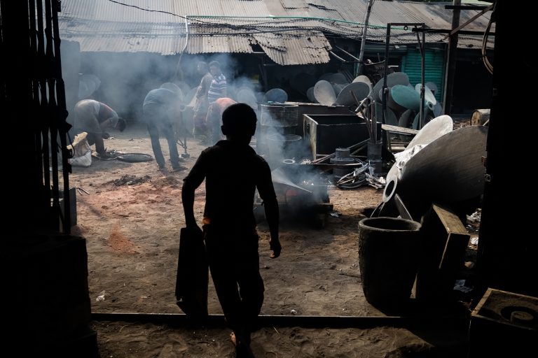 Dhaka, Bangladesh - March 26,2016: A Child Laborer is working inside a workshop at the Dock Yard in Dhaka, Bangladesh.