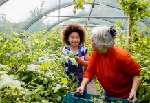 young girl volunteering in a garden