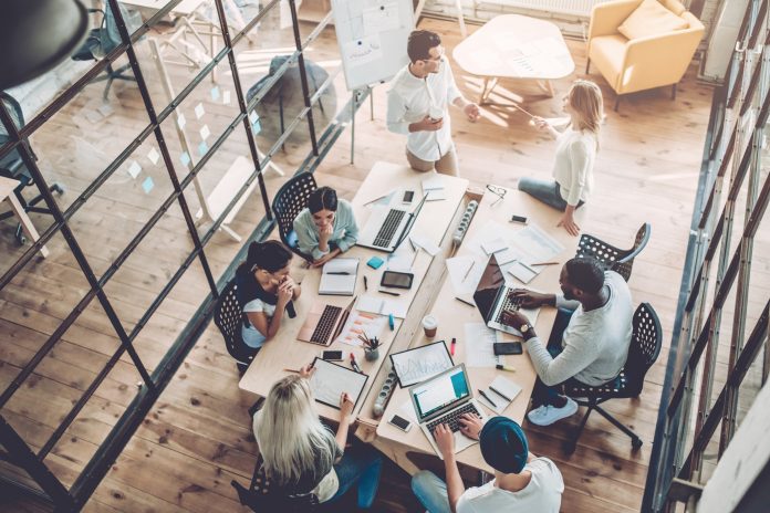 group of people working together in an office