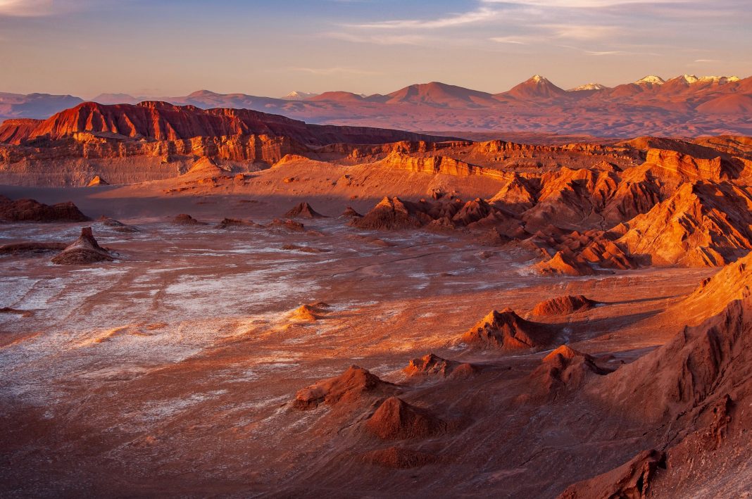 Atacama desert is the driest desert on the planet. The annual rainfall is average at 20mm. The main town where tourism bases is at San Pedro de Atacama. Atacama is located at high altitude and is part of the Andes mountain range with many active volcanos. The eerie moonscape in the area is a result of active tectonic movement. Salt deposit and salt flat are found easily in the desert.