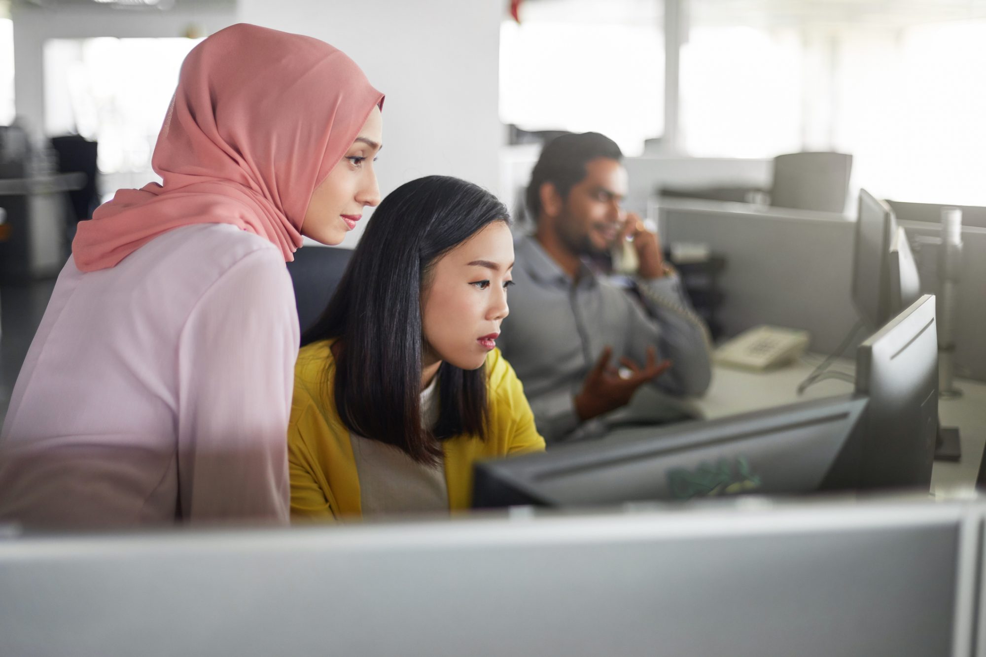 Women working in an office with technology