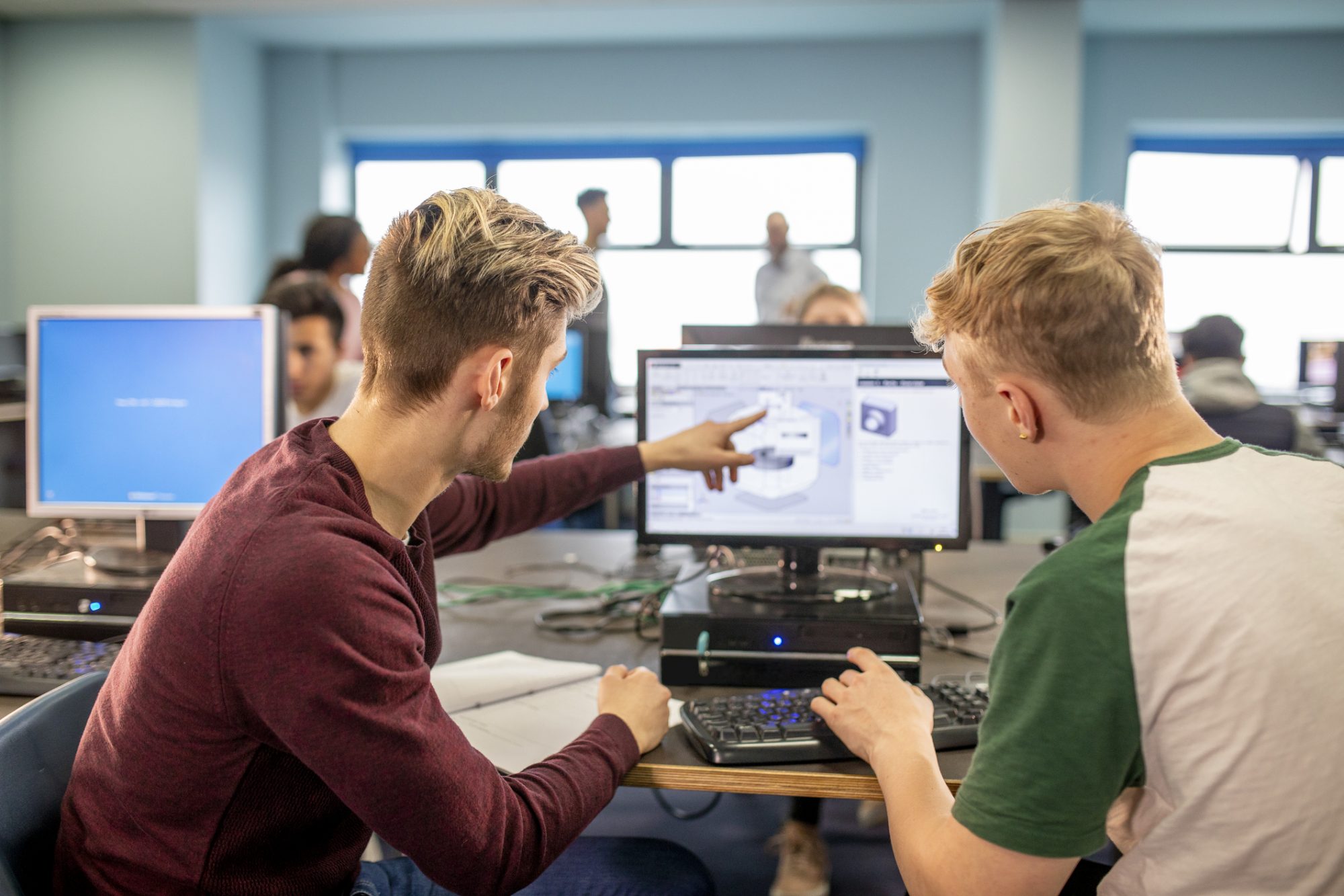 two people working on a course online