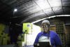 Serious employee using digital tablet at warehouse